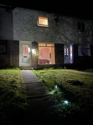 a house with a front door at night at Dumbarton With A View in Dumbarton