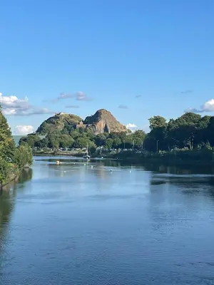 a river with trees and mountains in the background at Dumbarton With A View in Dumbarton