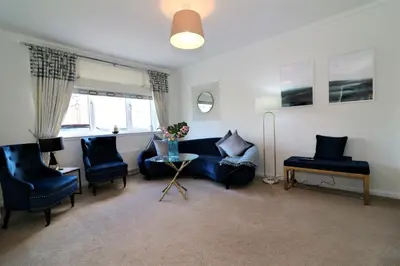 a living room with a couch and chairs and a table at Signature - Macneish House East Kilbride in East Kilbride