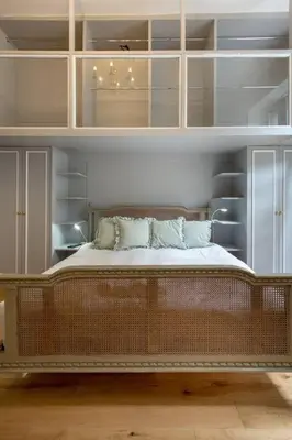 a bedroom with a large wooden bed with pillows at Frederick Street - stylish apartment in the heart of New Town! in Edinburgh