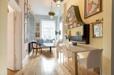a dining room with a table and chairs at Frederick Street - stylish apartment in the heart of New Town! in Edinburgh
