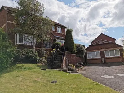a brown brick house with a driveway at Executive Annex - Dunfermline in Dunfermline