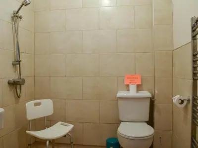 a bathroom with a toilet with a sign on it at Horsemill - Uk10794 in Ballingry
