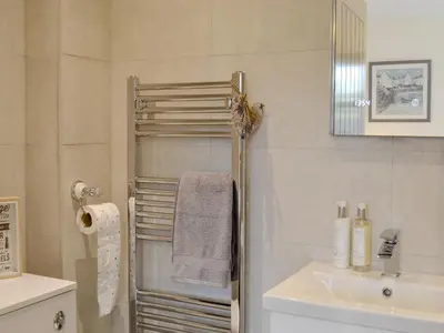 a bathroom with a sink and a towel rack at Thistlebank in Banknock