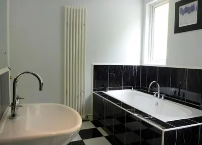 a bathroom with a sink and a tub and a window at Camus Bhan in Ballachulish