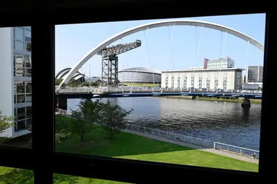 a view from a window of a bridge over a river at ArcView - SEC Hydro Two Bed Flat With Free parking and Great View in Glasgow