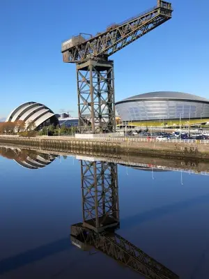 a reflection of a stadium in a body of water at ArcView - SEC Hydro Two Bed Flat With Free parking and Great View in Glasgow