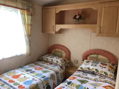 two twin beds in a small room at Bermuda 29 in Dunoon