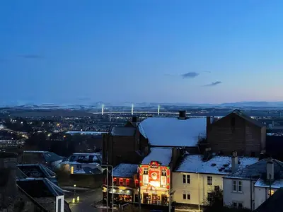 a view of a city with snow on the roofs at Carvetii - Edward House D - 2 Dbl bed 2nd floor flat in Dunfermline