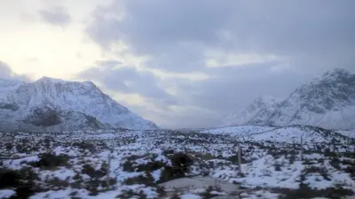 a snowy mountain range with mountains in the background at Argyllholidaycottage Loch Awe in Eredine