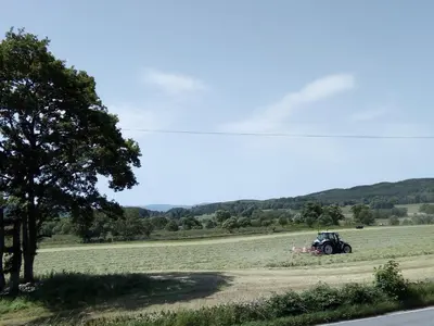 a tractor in the middle of a field at Dunchraigaig House in Kilmartin