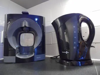 a coffee maker and a toaster sitting on a counter at Art Deco Building on Vibrant Sauchiehall Street in Glasgow