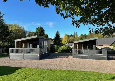 a rendering of a house with two pavilions at Lomond Woods Holiday Park in Balloch