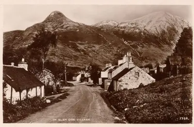 an old photo of a village with a mountain at Arivonie Lochside Cottage in Glencoe