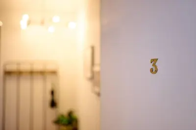 a door with the number five on it in a hallway at Exceptional Central 1BR Apt - town square views in Oban