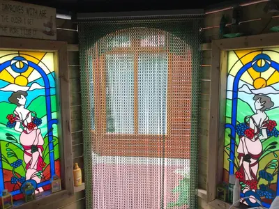 a door with stained glass windows in a room at Ramintoul Lodge in Glendevon