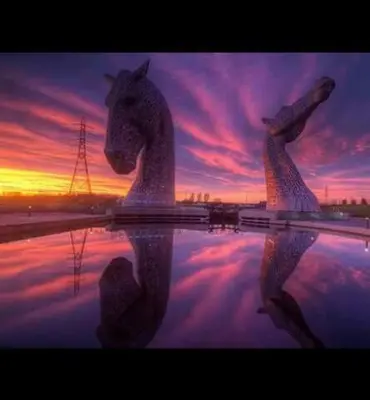 a statue of a horse with its reflection in the water at The Victoria Inn Blythswood Snug in Falkirk