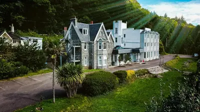 an aerial view of a large house at The Lodge on the Loch by OYO in Onich