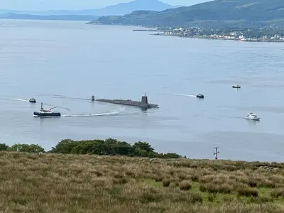 a group of boats in a large body of water at Knockderry Lodge -Private Luxury pet-friendly accommodation in Scotland with hot tub in Cove