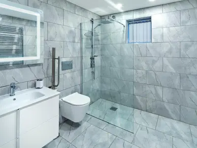 a bathroom with a toilet and a sink and a shower at White Watch in Lochaline