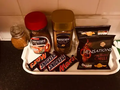 a container filled with peanut butter and other food items at Anna apartment in Edinburgh