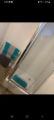 a glass door of a refrigerator with a blue sponge at Panoramic Harbour View Apartment in Oban