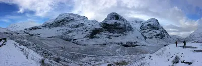 two people standing on top of a snow covered mountain at Hawthorn Cottage in Glencoe