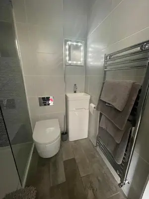 a small bathroom with a toilet and towels at Saorsa House Culross in Fife