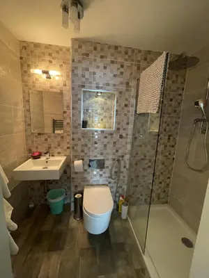 a bathroom with a toilet and a sink and a shower at Saorsa House Culross in Fife