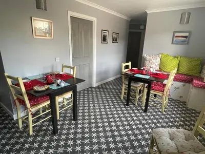 a dining room with a table and chairs at Saorsa House Culross in Fife