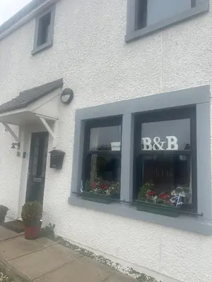 a building with a window with a bbc sign in it at Saorsa House Culross in Fife