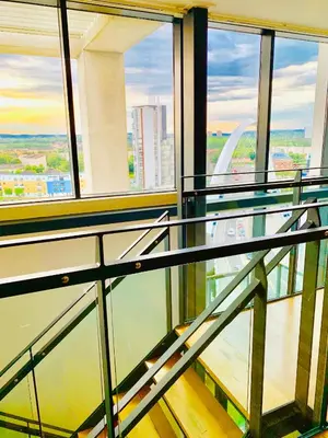 an empty glass floor in a building with windows at Glasgow City Centre - The PENTHOUSE with RiverViews - (Duplex, 3 Bedrooms, 3 Bathrooms, 2 Living rooms/Kitchen, Private SKY Terrace, 2 Parkings, Top Floor, Huge - 2100 sq ft, SECC HYDRO) in Glasgow