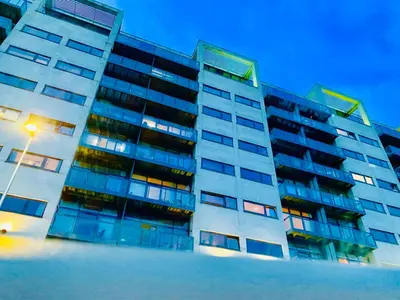 a building with a street light in front of it at Glasgow City Centre - The PENTHOUSE with RiverViews - (Duplex, 3 Bedrooms, 3 Bathrooms, 2 Living rooms/Kitchen, Private SKY Terrace, 2 Parkings, Top Floor, Huge - 2100 sq ft, SECC HYDRO) in Glasgow