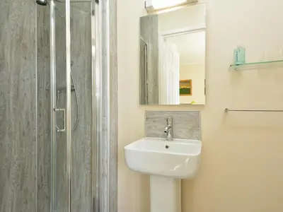 a bathroom with a sink and a shower at Westburn in Comrie