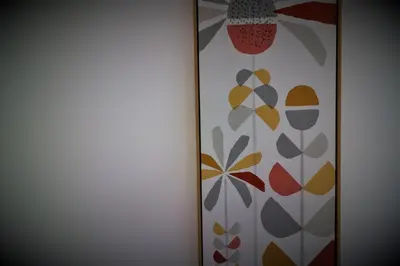 a wall with two paintings of flowers on it at Signature - Shawburn House in Hamilton