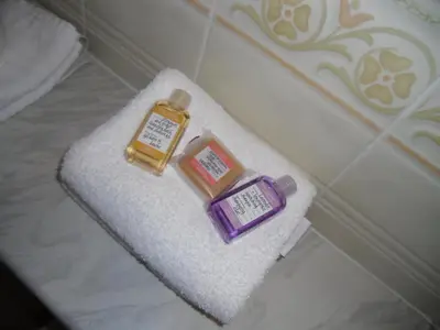 a couple of bottles of soap sitting on a towel at Ormidale Hotel in Brodick