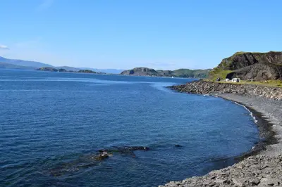 a large body of water with a rocky shore at Number 10, Isle of Luing in Cullipool