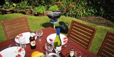 a wooden table with wine bottles and glasses on it at Ginger's in Stirling