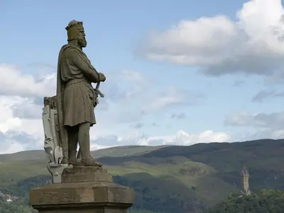 a statue of a man standing on top of a mountain at Ginger's in Stirling