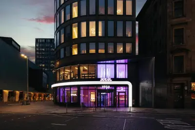 a building with purple lights in front of it at YOTEL Glasgow in Glasgow