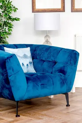 a blue couch in a living room with a lamp at Heart of Edinburgh City Centre 3 Bed Georgian Apt in Edinburgh