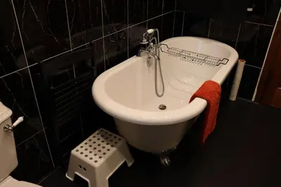 a bathroom with a sink and a bath tub at Gowanlea Heights in Campbeltown