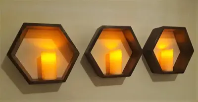 two lights are hanging on a wall at Airdrie Apartments in Airdrie