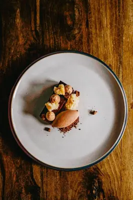 a piece of food on a plate on a table at Coorie Inn Restaurant and Rooms in Crieff