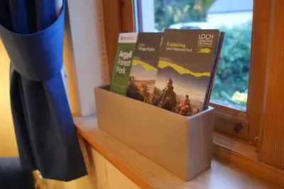 a box of books sitting on a window sill at Shegarton Farm Cottages in Luss