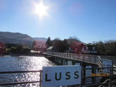 a sign on a bridge over a river at Levenhowe Holiday Apartment in Balloch