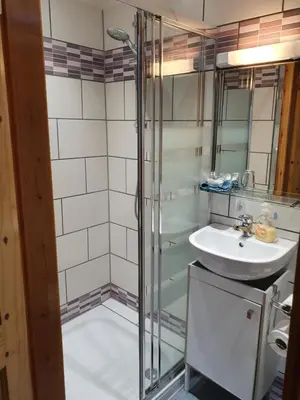 a bathroom with a shower and a sink at B&B Drum Farm in Stirling