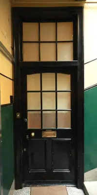 a black door with glass panels in a building at Woodburn Terrace, Morningside, Edinburgh in Edinburgh