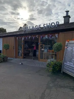 a large shop with a sign in front of it at Fab-u-Luss in Luss