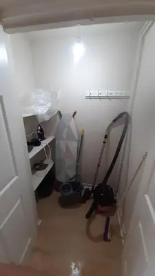a hallway with a room with a mop and a vacuum at Carvetii - Clark House - Spacious ground floor flat in Rosyth